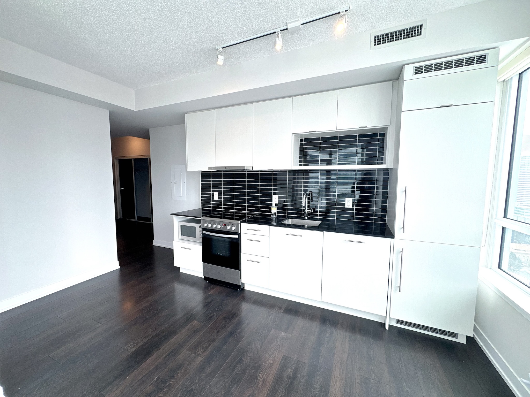 Dining area combined with living — walkout to balcony