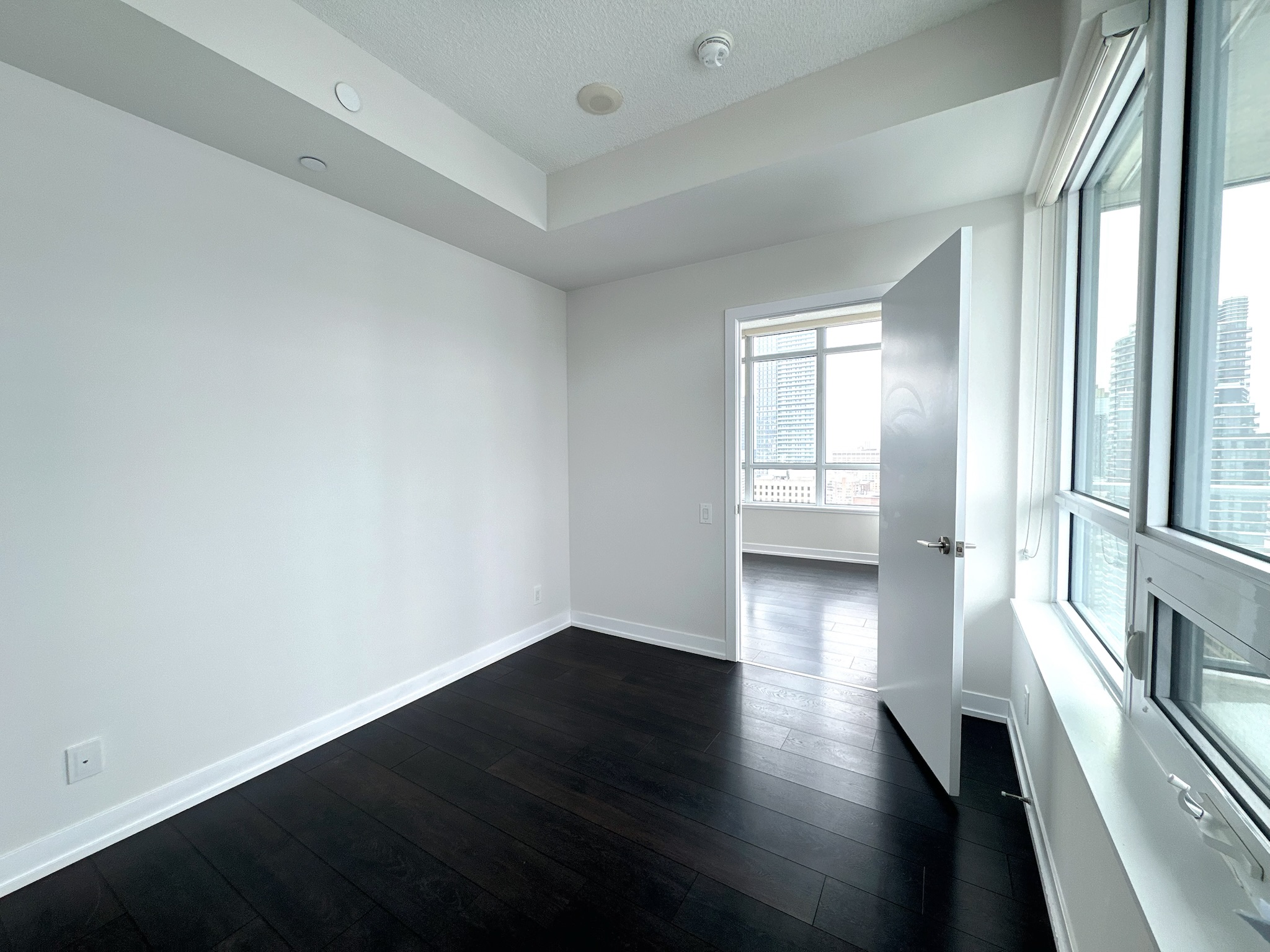 Open-concept den — perfect as home office or second bedroom