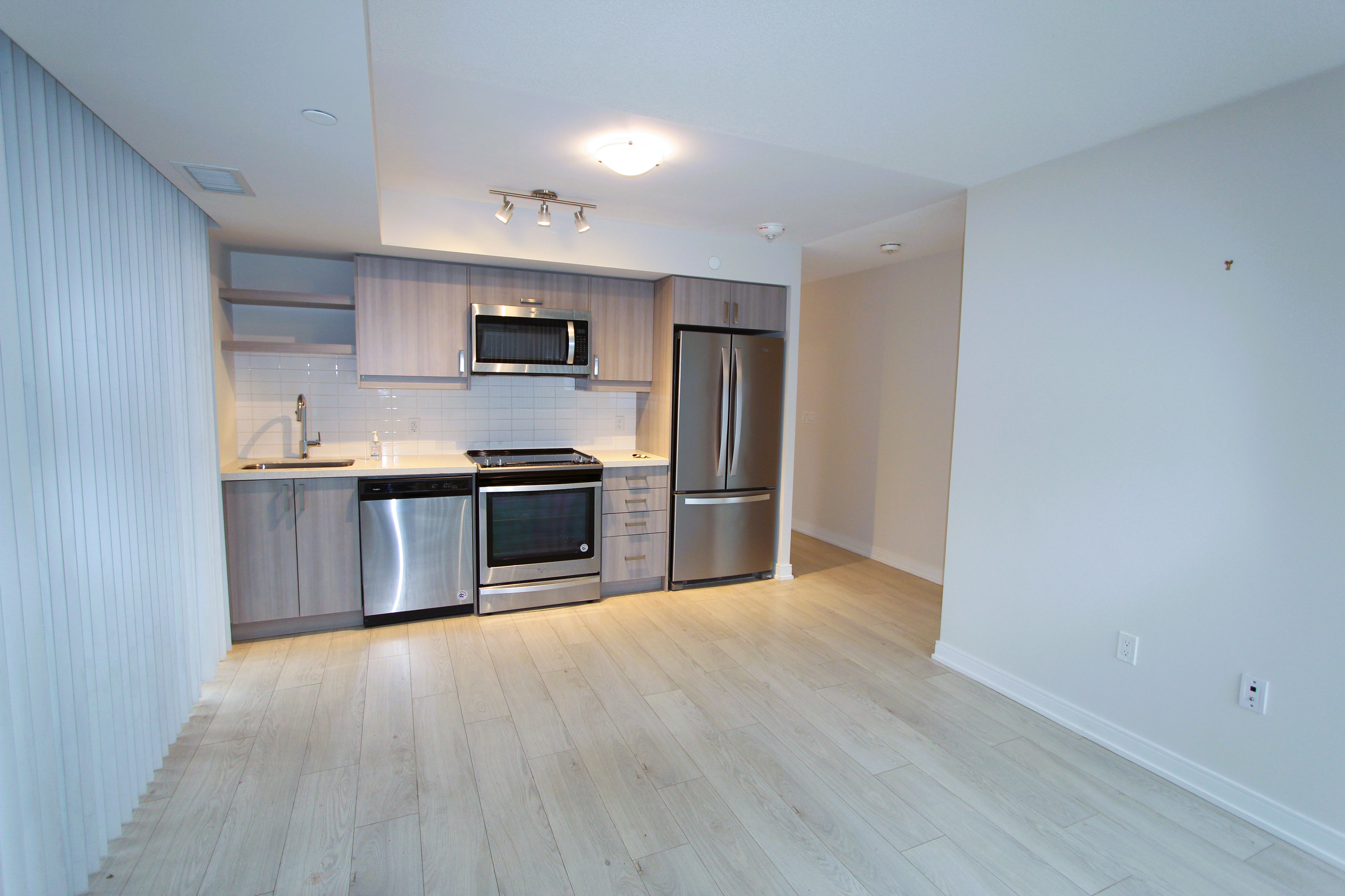 Kitchen detail — quartz countertops and stainless steel appliances