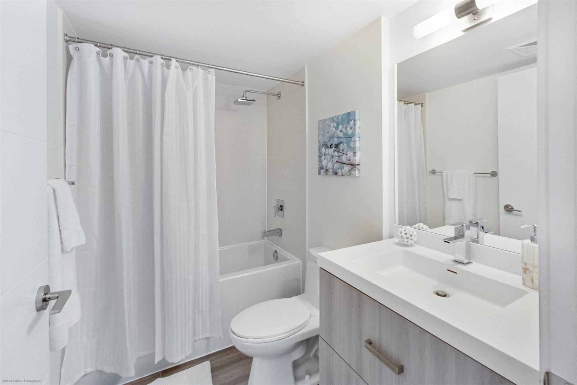 Ensuite laundry — stackable washer and dryer