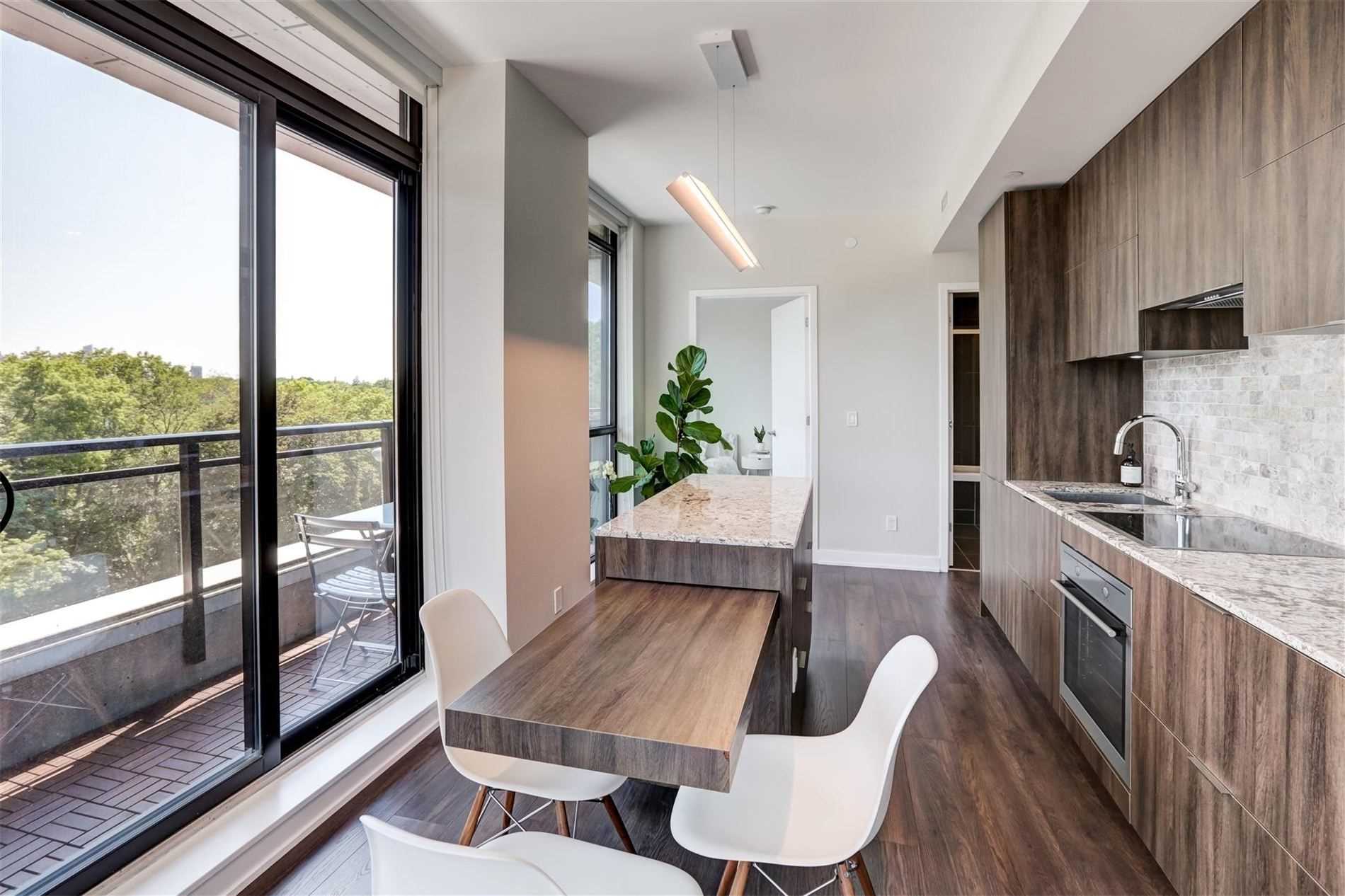 Primary bedroom — laminate flooring and natural light