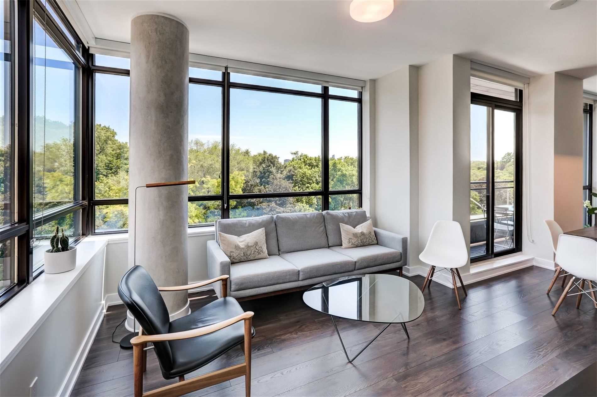 Open-concept dining and kitchen with centre island and walkout to balcony