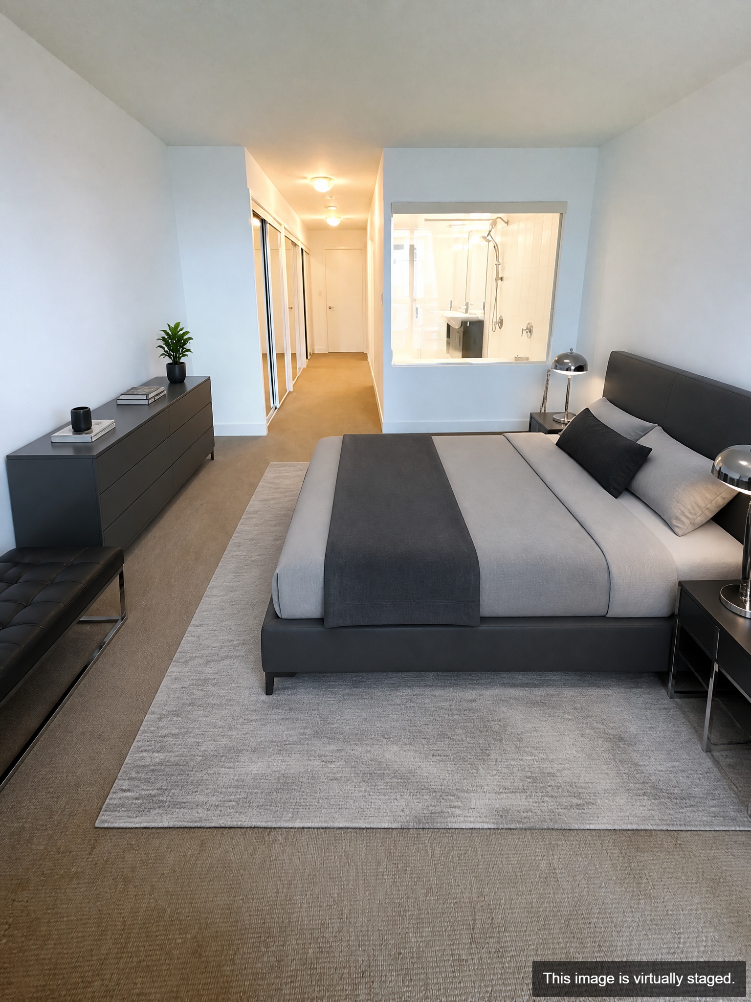 Virtually staged — primary bedroom with 5-piece ensuite and large closet