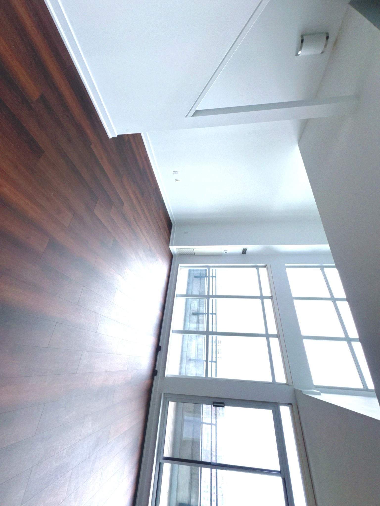 Two-storey loft staircase with 9 ft ceilings and double-height volume