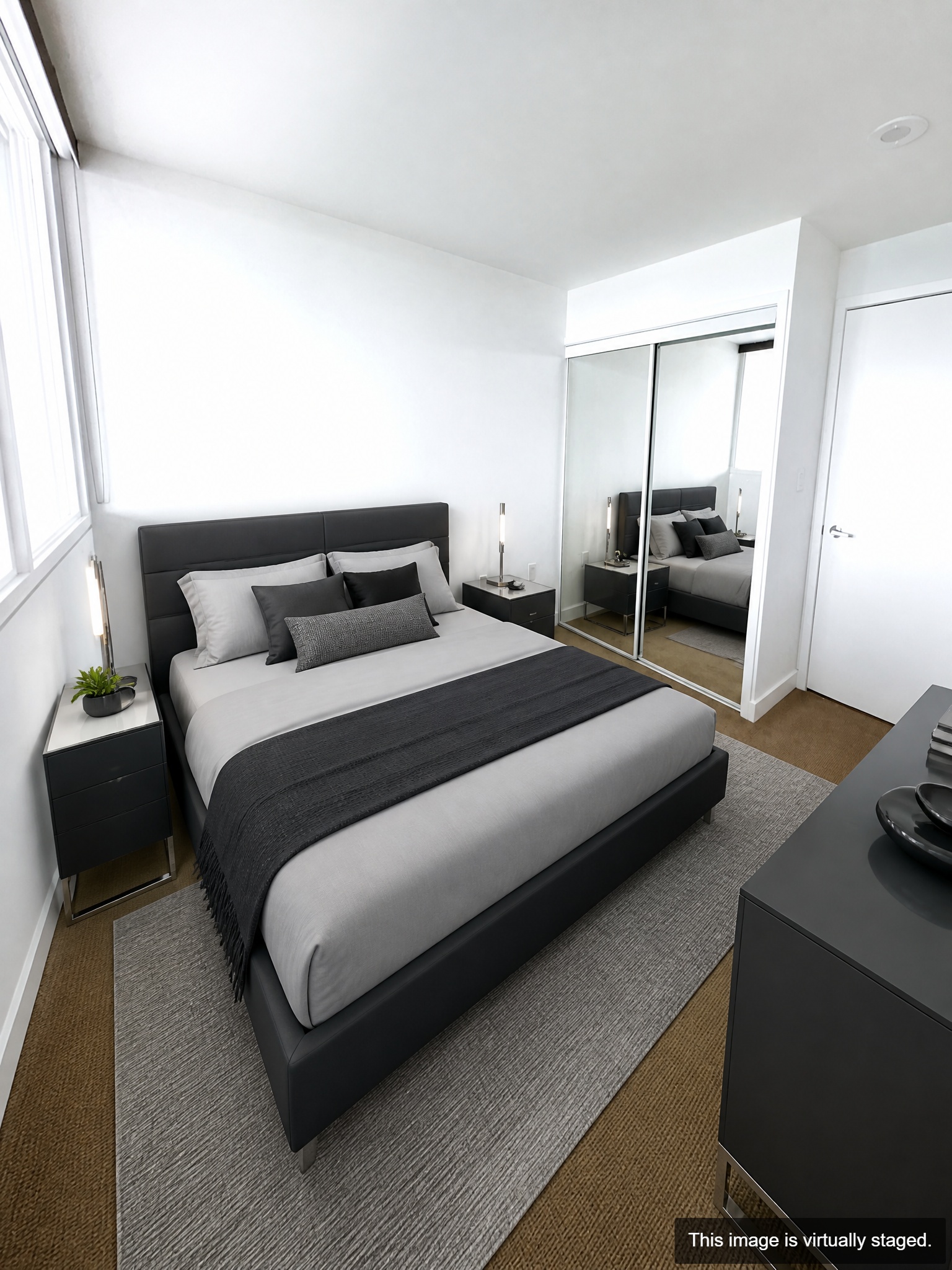 Virtually staged — second bedroom with mirror closet